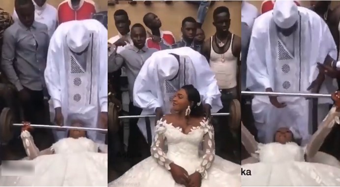 Chaos as Bride in wedding gown seen lifting weight on her wedding day [Watch]